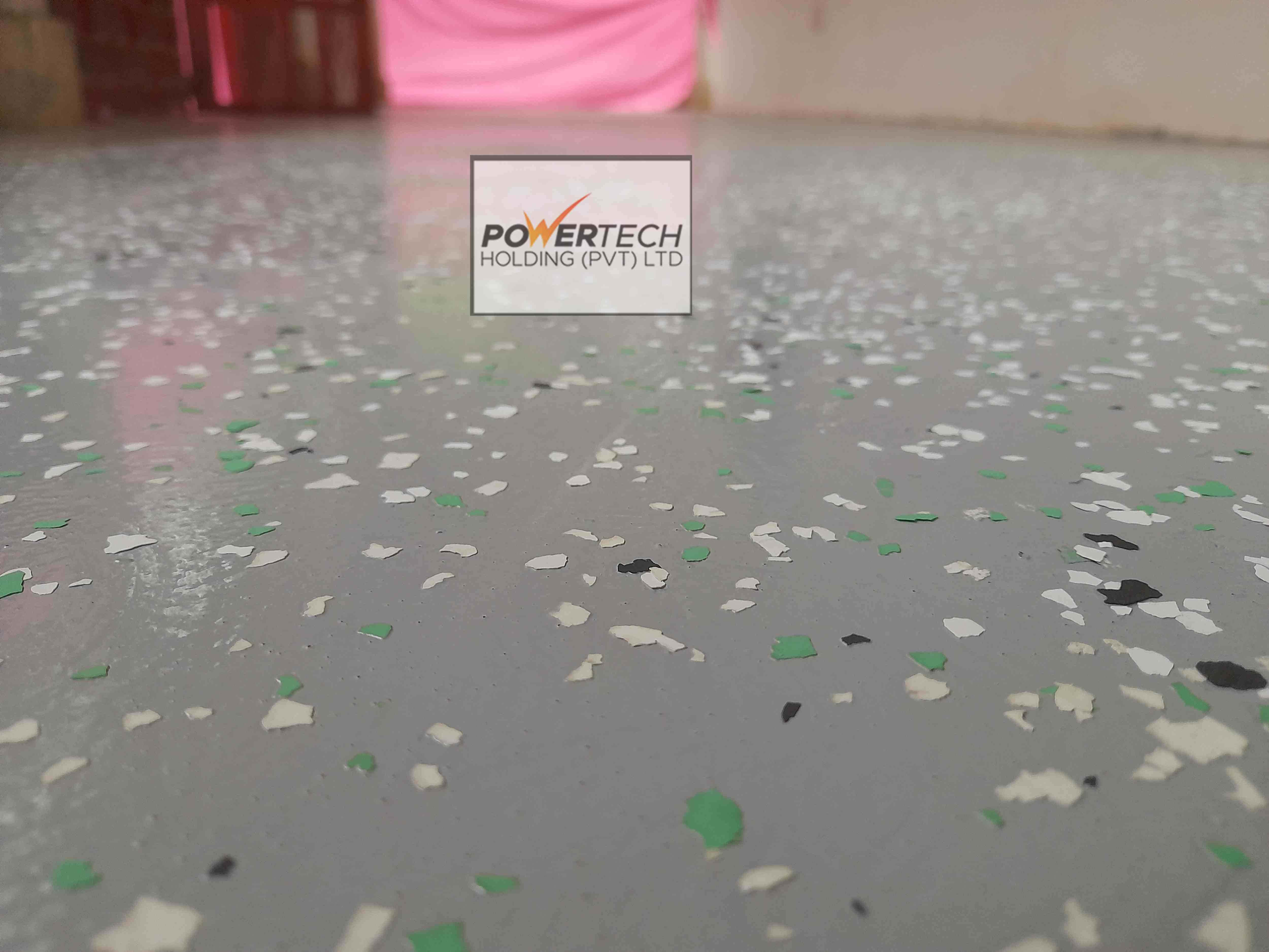 epoxy flake floor with helicopter in storage