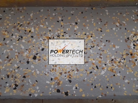 epoxy flake floor with helicopter in storage